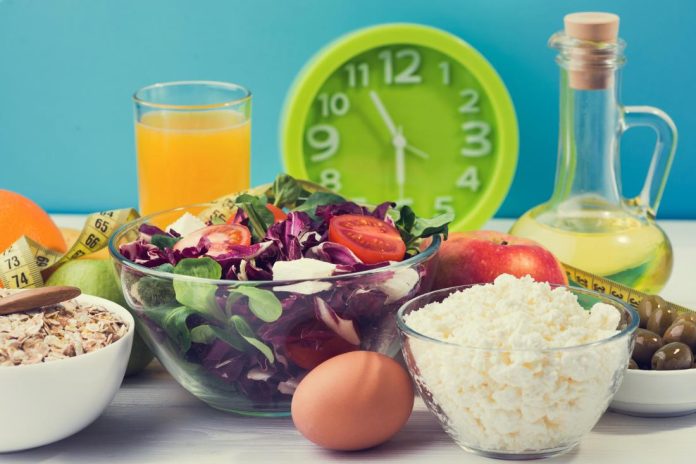 salad-juice-and-a-clock Boost Your Metabolism